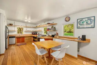 The large kitchen has room for in-kitchen dining. A glass door leads to the front yard- out of view.