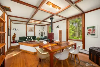 The dining room also has boxed beam ceilings and old style wood floors.