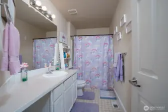 Full bathroom in hallway.