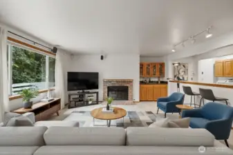 Nice cozy wood burning fireplace in the virtually staged living room