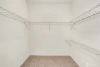 Walk-in closet for primary bedroom.