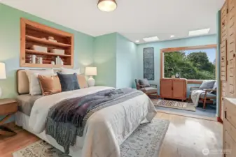 Main floor bedroom with hardwood floors, sunroom addition (skylights, Anderson windows, heated stone floors - $80,000 project), custom cedar wood bump out shelves and armoire.