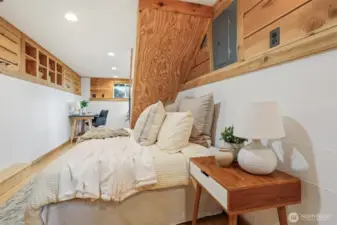 Lower level multi purpose living area:  office, bedroom, family room, etc.  Features:  bamboo floors, cedar built in storage and closet. Has a separate entry and 3/4 bathroom.