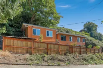 Unique property with 2 homes on 1 lot, Cottage home to the left (north), Main home to the right (south).