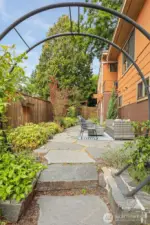 Professionally architect designed ($50,000 project)  fenced courtyard with access to the Main south home lower level and custom built cedar shed.
