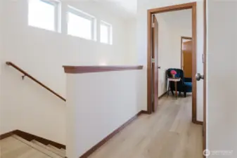 Stairs with the hat to the primary bedroom, linen closet on the right..