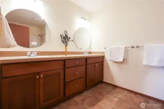 Primary bathroom with 2 sinks, toilet, bath, and shower