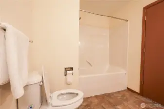 Primary bathroom with 2 sinks, toilet, bath, and shower