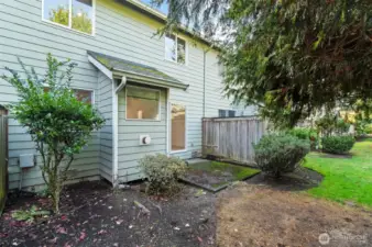 Low-maintenance backyard perfect for outdoor dining or container gardening.