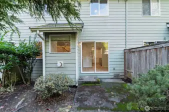 Simple, low-care outdoor space ideal for relaxing or setting up a small garden.