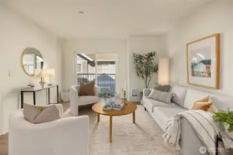 Bright and spacious living room with Juliet balcony overlooking the center courtyard.