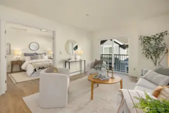 Double doors lead to the generous primary suite. Beautiful Pergo flooring.