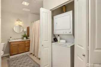 The spacious bath has wonderful floor space and a laundry nook behind double doors. The washer & dryer are included in this sale.