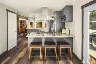 Stainless steel hood over the gas stove.