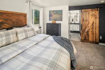 Primary suite with remodeled 5-piece bath & walk-in closet.