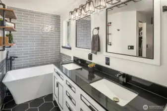 Walk-in shower, free-standing tub, new vanities & light fixtures.