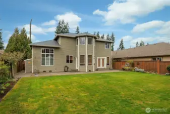 Large level backyard. Back of home plumbed for gas for your BBQ, w/water & power also.