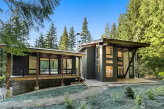 A view of the guest home and main house on the south side of the homes. You can see there is a nice walk way and recently landscaped with irrigation installed.