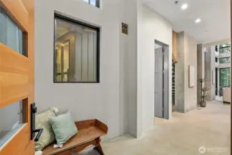 The front door was strategically placed in the back of the home to allow for the floor to ceiling windows. So well thought out.