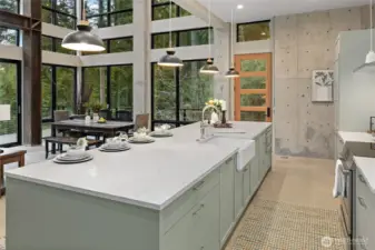 View of the galley kitchen that allows you to be involved with others in the home. What a great design.
