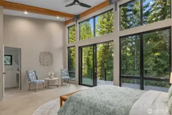 Who would not want to stay here? The floor to ceiling windows bring in nature and gives that "tee house" feeling again. You can see entrance into the guest house bathroom.