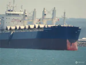 CLOSE-UP OF THE SHIP ANCHORED IN THE HARBOR