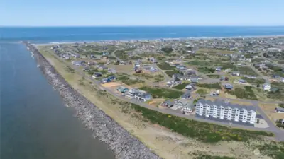 FRONT VIEW OF THE CONDO SHOWING THE BEACHES AND HOMES IN THE AREA!