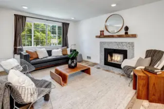 Warm up by the inviting wood-burning fireplace in the living room, perfect for cozying up on chilly nights.