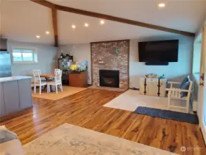 Spacious living area with vaulted ceilings and lots of canned lighting.