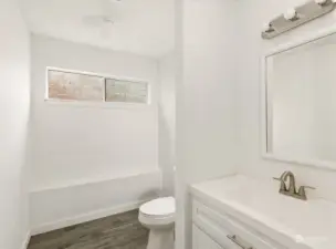 Downstairs half bath with ample space to create that 3/4 or full bath.