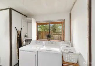 Utility area in garage features laundry.