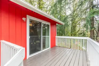 Deck off the kitchen and dining area features private outdoor space and stairs to the backyard.