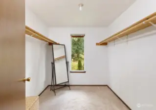 Spacious walk in closet in the primary bedroom with plenty of natural light and storage.