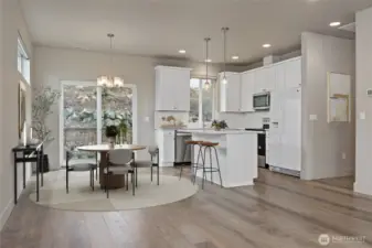 Kitchen and Dining area viewed from the Living Room (virtually staged)