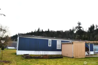 The yard space immediately behind the shed is yours! The raised beds need a little TLC to make them thrive again, or you could do something completely different with the space.