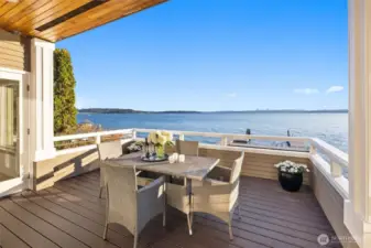 Main floor large Trex deck offers al fresco dining with expansive waterfront views—every day feels like a getaway.
