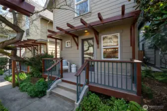 The front porch welcomes you home to this very special and spacious in-city retreat surrounded by lush landscaping and a beautifully maintained courtyard. The mature greenery provide year-round beauty with vibrant colors that change with the seasons.