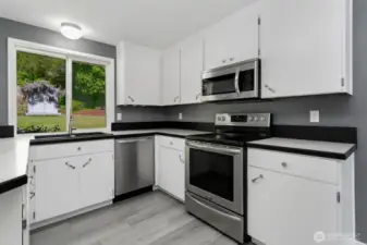 Newer appliances and elegant finishes throughout refreshed kitchen.