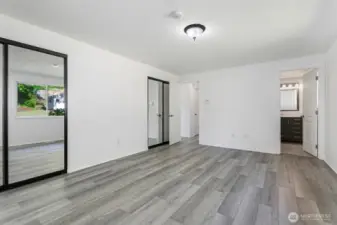 Primary bedroom boasts two large closets and en-suite