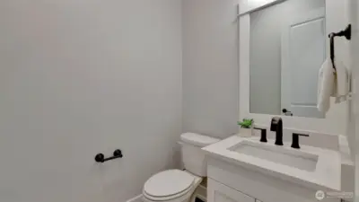 Just down the hall from the main living space is the half bath.