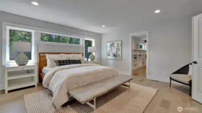 With the natural light beaming through the windows and light finishes this room provides a calm feel. To the right is a custom closet with all the room you'll need and to the left is a beautiful en-suite.