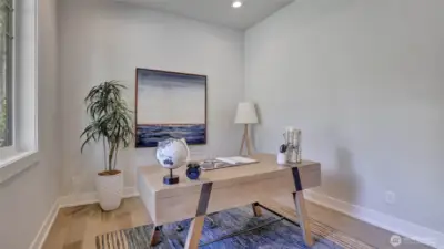 Conveniently located den/office on the main level with an abundance of natural light and tucked next to the entry of the home.