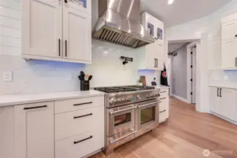 Quartz countertops and backsplash. Nice double island.