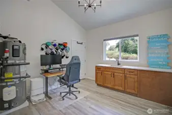 Extra large Laundry room with sink and closet with freezer