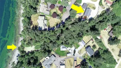 State land with beach adjacent to home