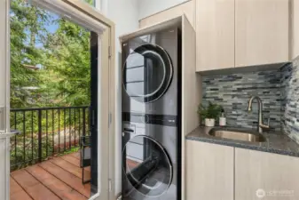 The laundry area was also re-designed adding a one-piece LG Smart Tower stacking W/D and incorporating a new handy sink too.