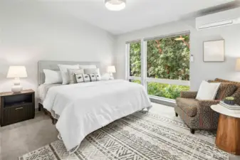One of two ensuite bedrooms on the upper level. The entire home has an upgraded heat pump system for efficient cooling and heating.