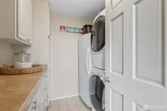 Main floor utility room with full freezer