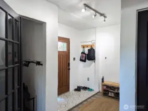 Entry with 2 areas for storage. Open closet.