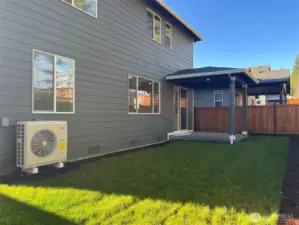 Back of home and half covered patio